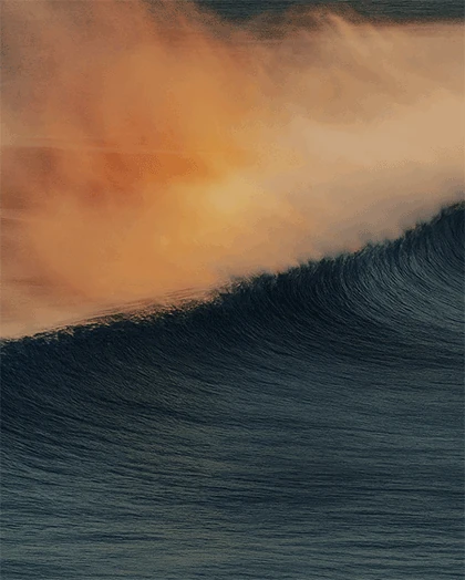 Wave crashing at sunset