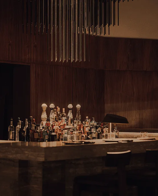 Bar shelves stocked with spirits at Óris