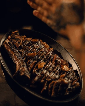 Char-grilled tomahawk chop served at Óris